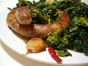 sausages and turnip greens in the pan